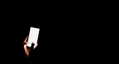 Mobile phone being used at night